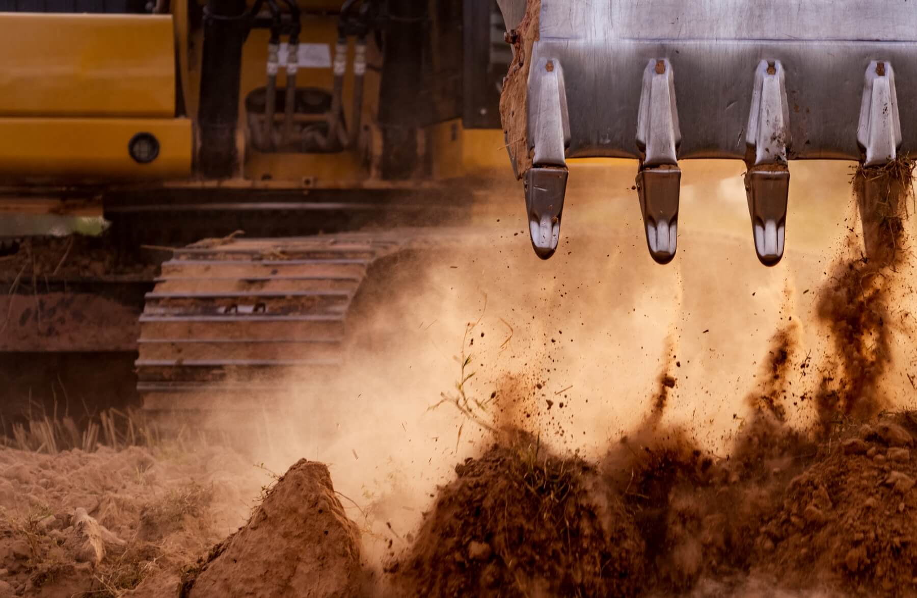 Excavator bucket and boom on a Cactus Equipment machine